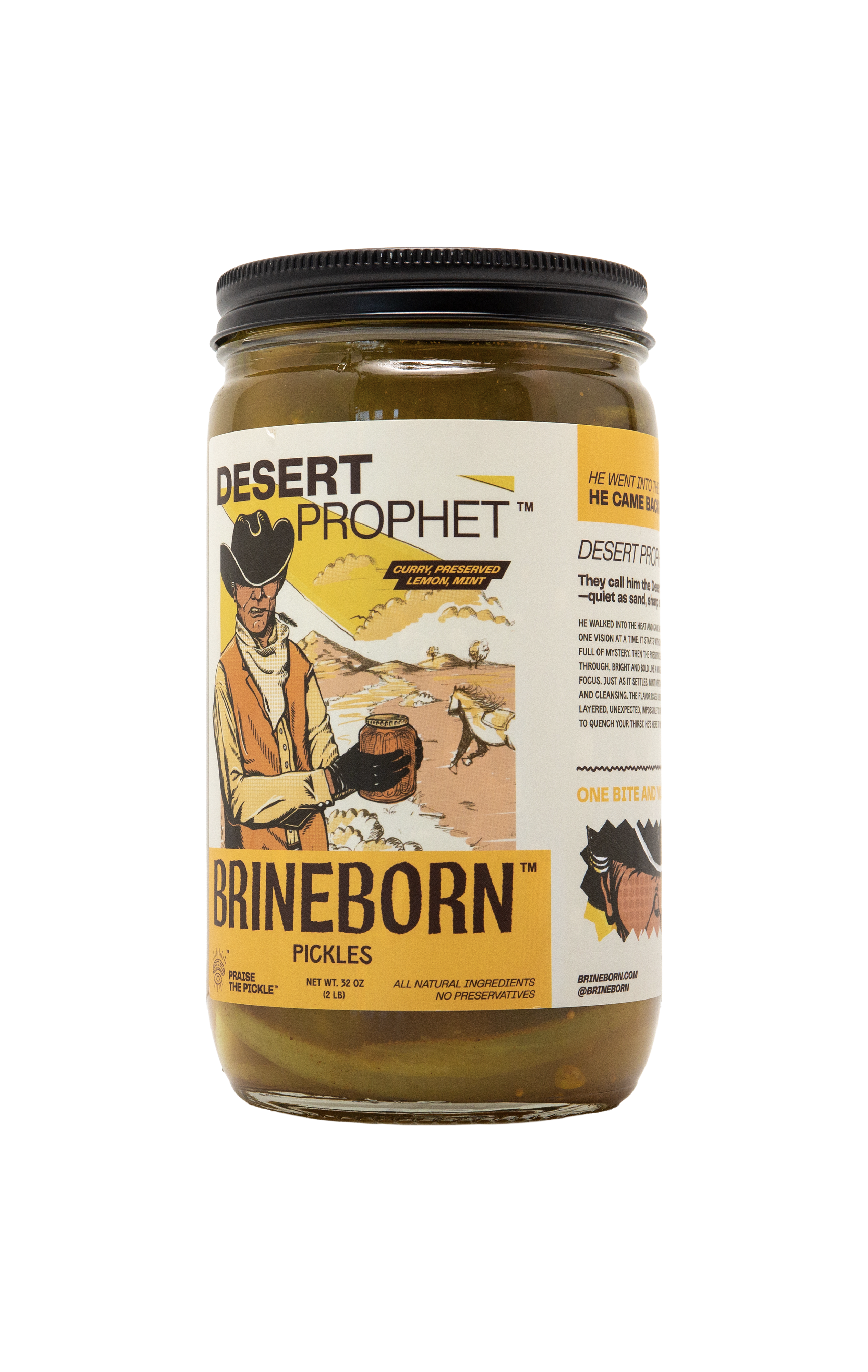 Glass jar of Brineborn Desert Prophet pickles with a yellow and white front label showing an illustrated cowboy holding a jar, with side product text partially visible.