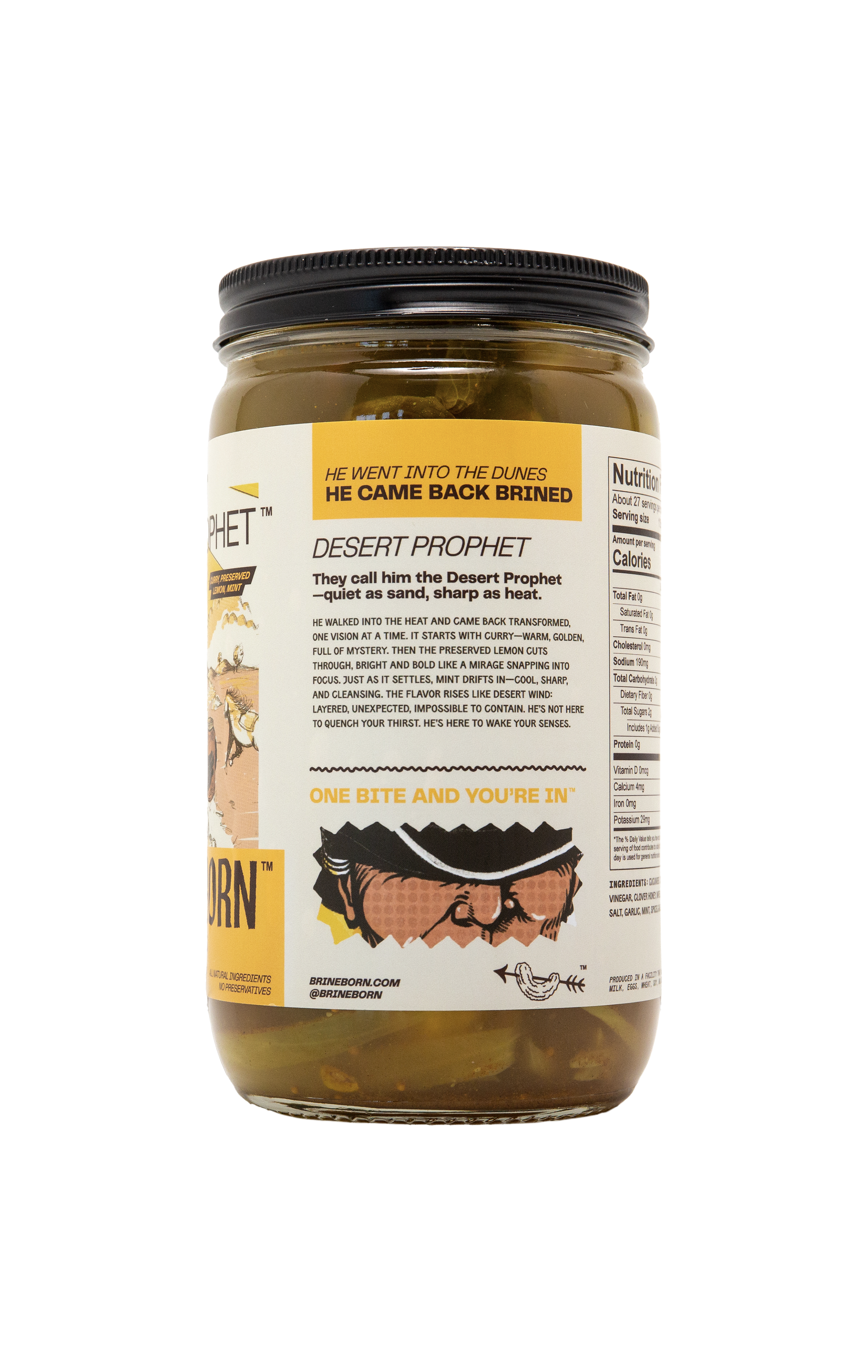 Side view of a Brineborn Desert Prophet pickle jar with a yellow and white label showing product description text, nutrition facts, and a small cowboy illustration.