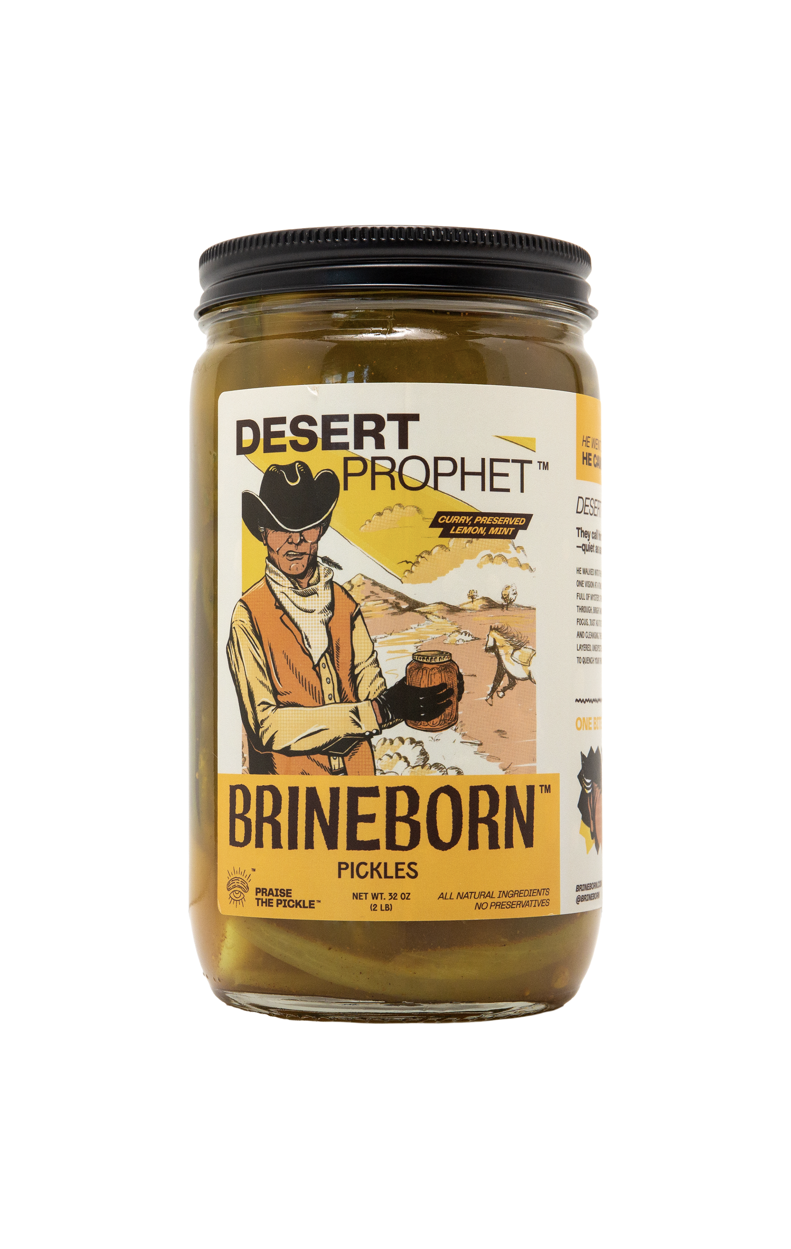 Glass jar of Brineborn Desert Prophet pickles with a yellow and white label showing an illustrated cowboy holding a jar in a desert scene.