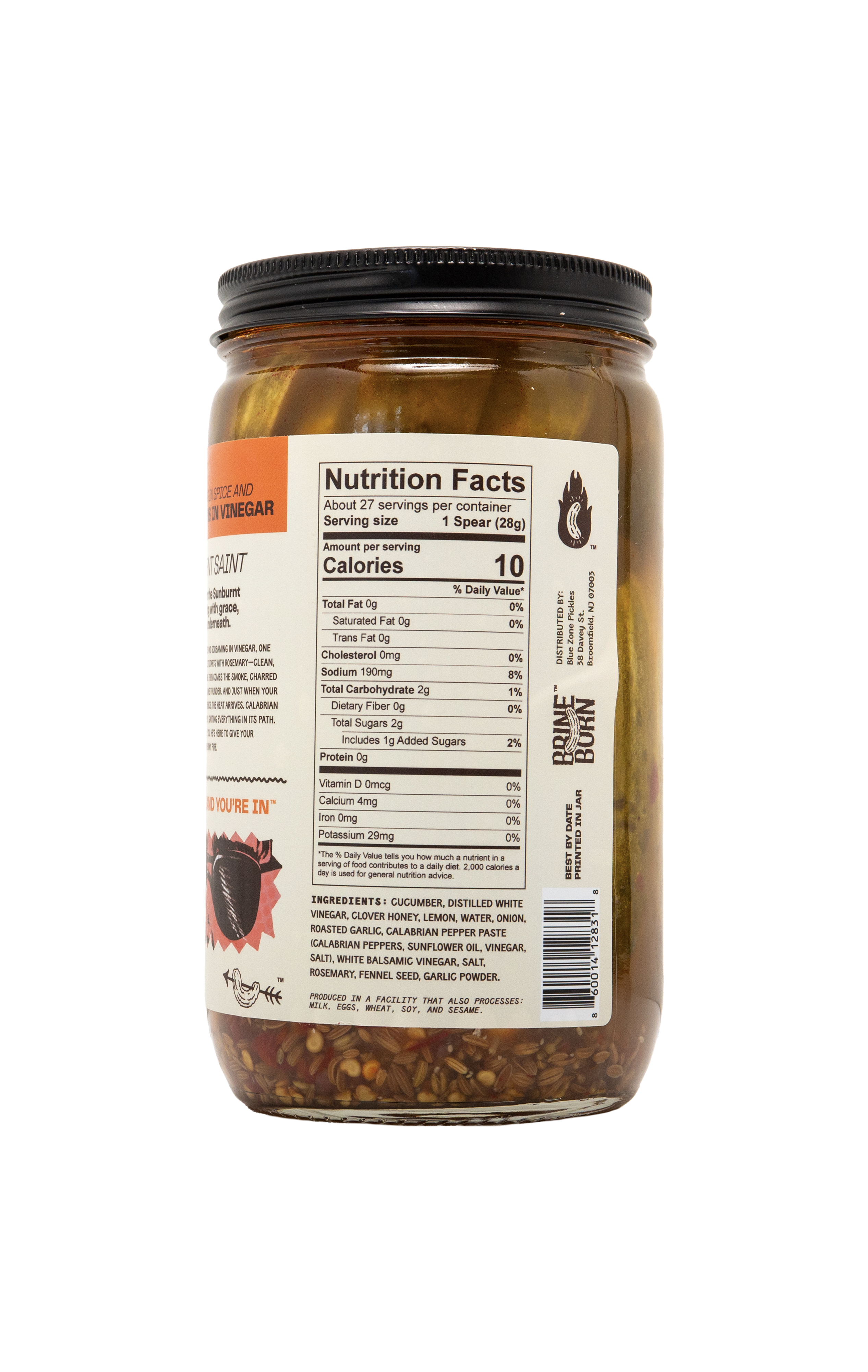 The back of a Brineborn pickle jar showing the Nutrition Facts label, ingredients list, and a barcode. Pickled cucumbers and spices are visible through the clear glass jar, which has a black lid and sits against a transparent checkered background.